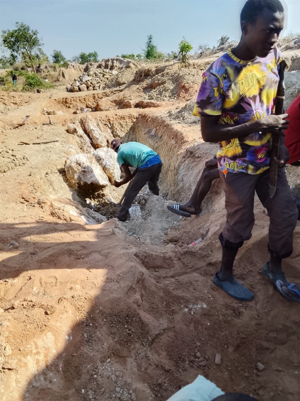 Our team digging a trench at the site