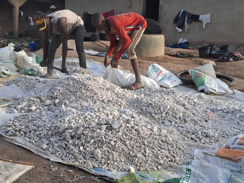 Local team members sorting ore by hand